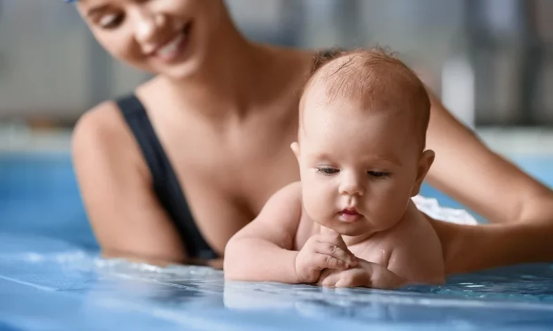 Mother and baby in water